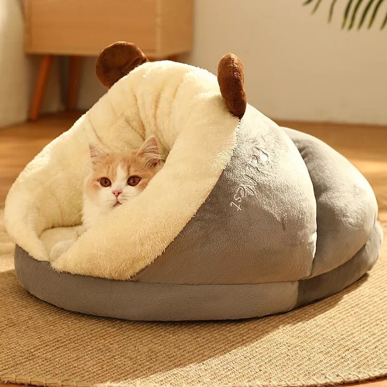 Cat cozy in plush pet bed.