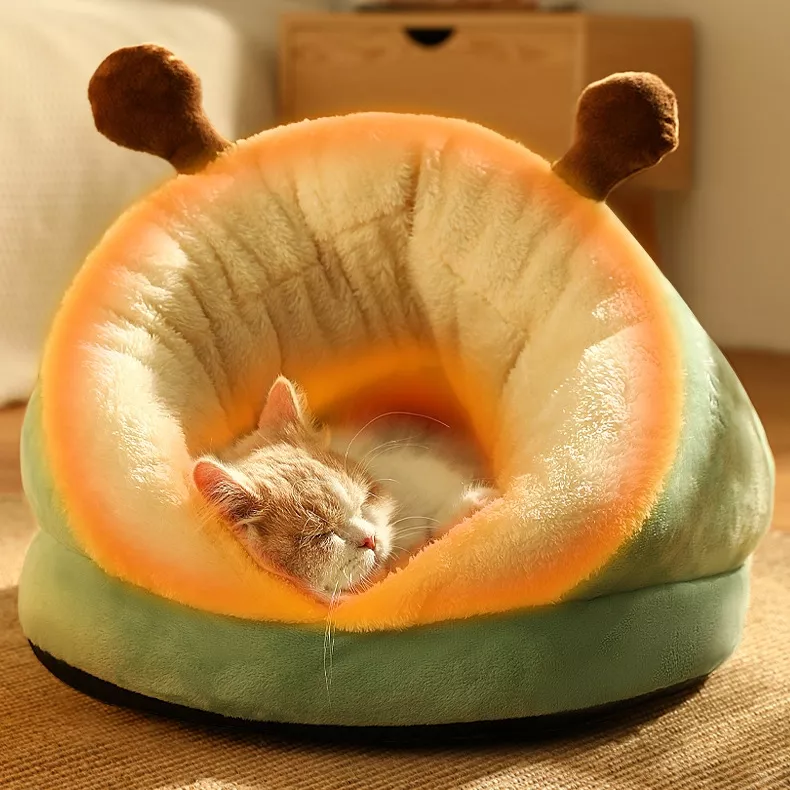 Cat sleeping in cozy plush bed