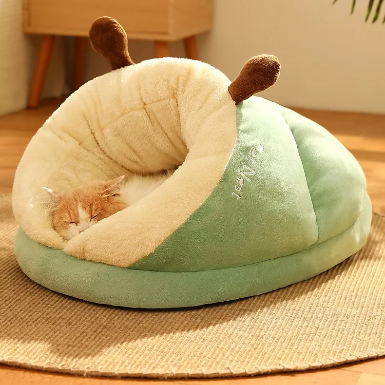 Cat sleeping in plush snail-shaped bed.