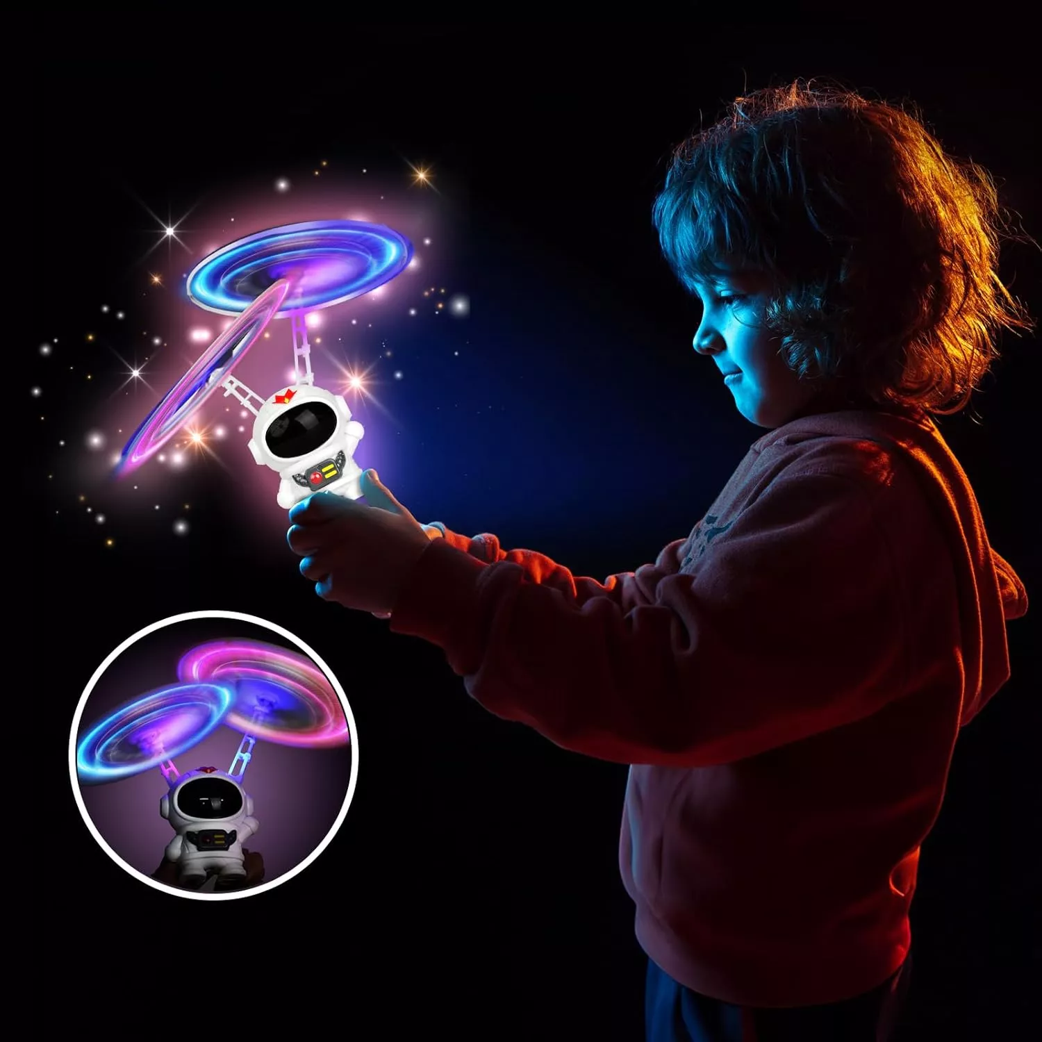 Child with glowing spinning toy in dark room.