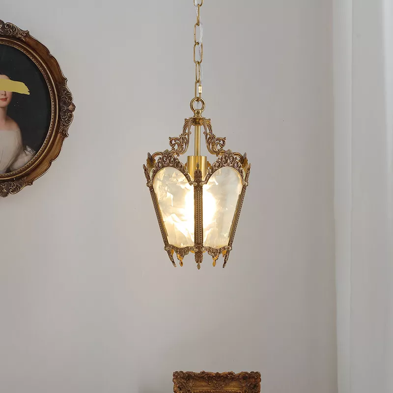 Vintage brass chandelier in elegant interior setting.