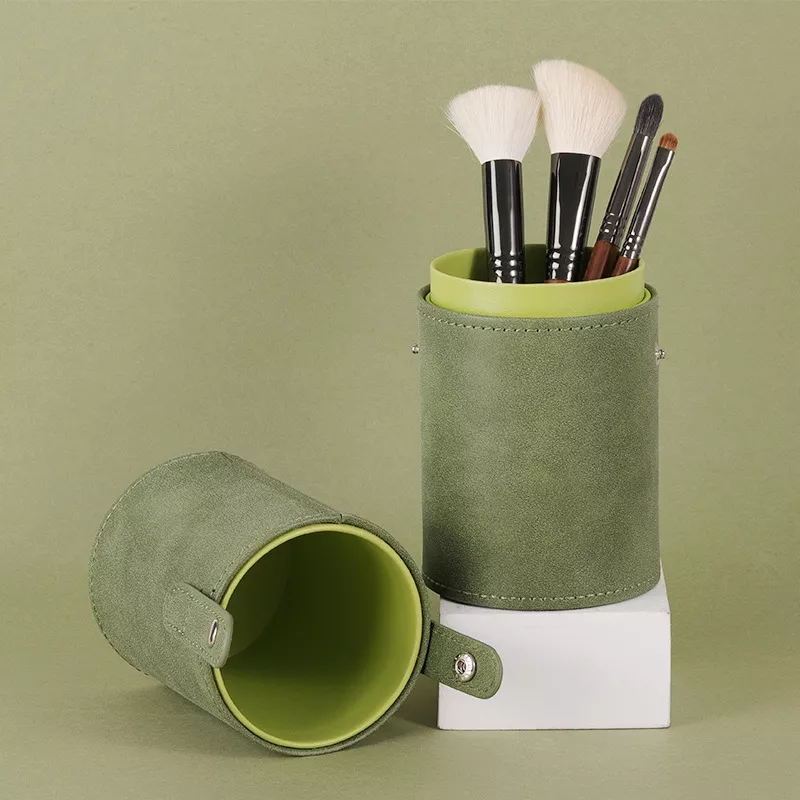 Green makeup brush holder on display