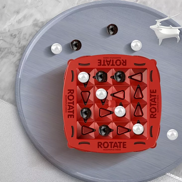 Red board game with black and white marbles.