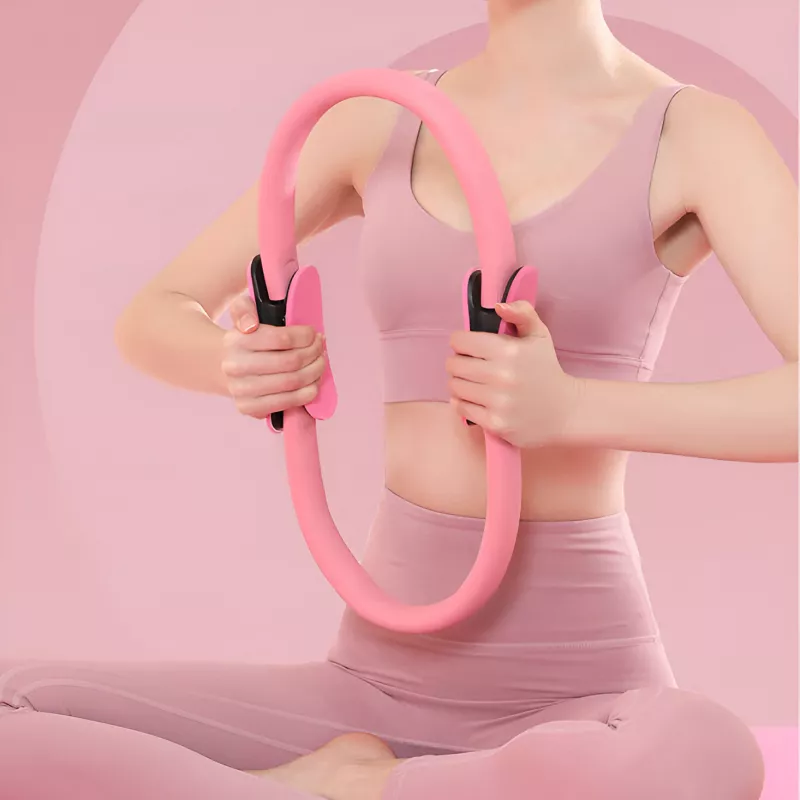 Woman using a pink Pilates ring